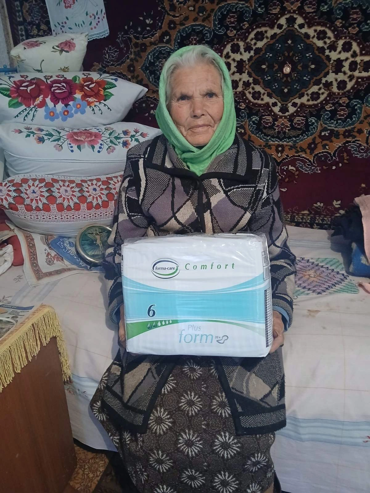 Old lady receiving incontinence underwear